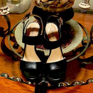 Black Leather Wedge by Guess Height of the wedge 4.5 inches,  width 2.75 inches